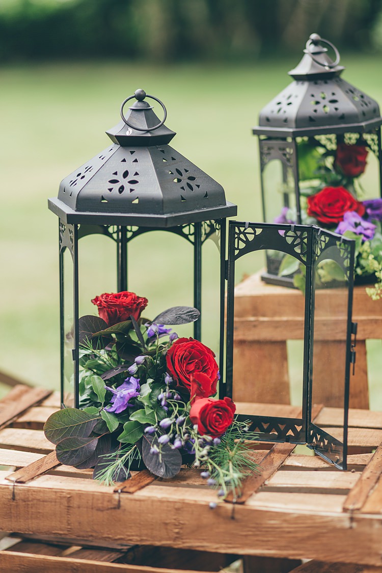 Lanterns Flowers Decor Red Roses Beautiful Floral Bohemian Garden Wedding http://rachellambertphotography.co.uk/