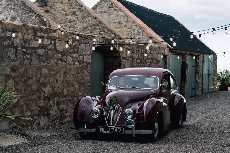 Red Classic Car Transport Twinkling Rustic DIY Barn Wedding https://www.harperscottphoto.com/