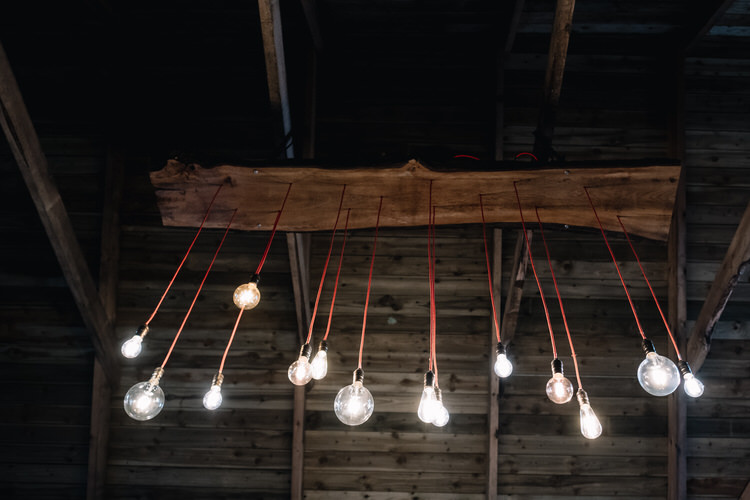 Edison Bulb Lighting Installation Twinkling Rustic DIY Barn Wedding https://www.harperscottphoto.com/