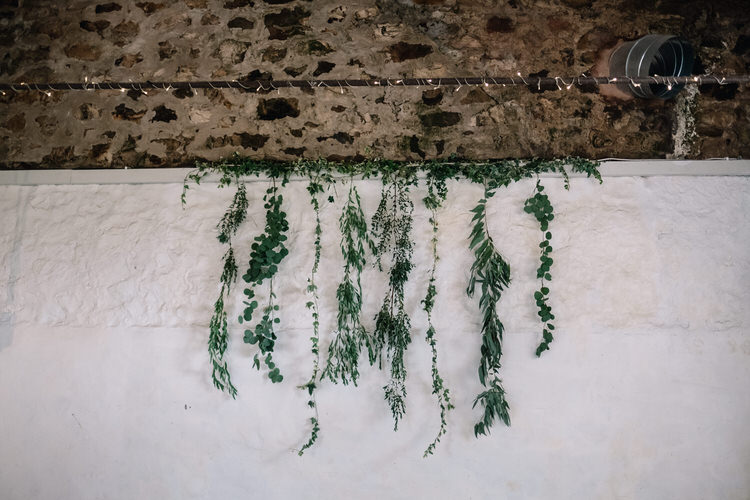 Greenery Foliage Hanging Backdrop Ceremony Twinkling Rustic DIY Barn Wedding https://www.harperscottphoto.com/