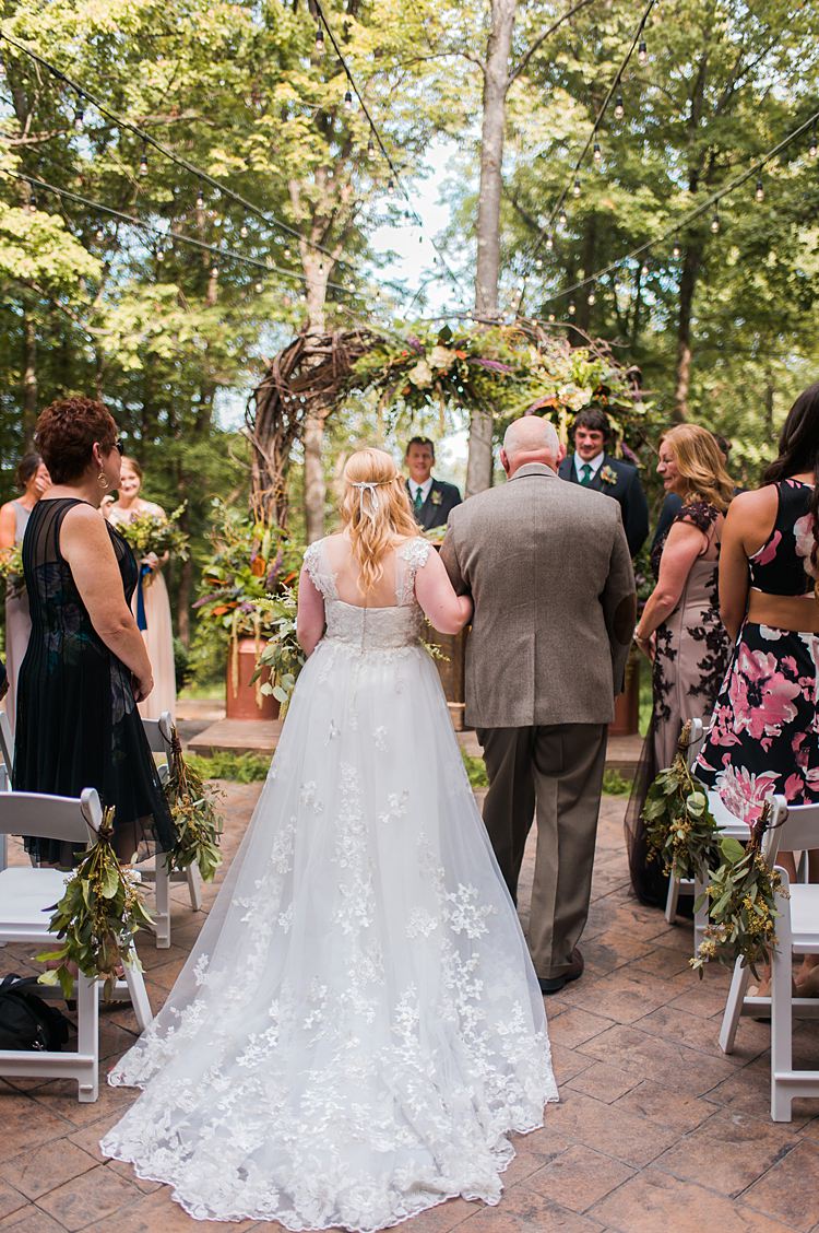 Bride Aisle Lace Train Cap Sleeve Ceremony Outdoors Arch Branches Whimsical Woods Wedding Barn Ohio http://www.connectionphotoblog.com/