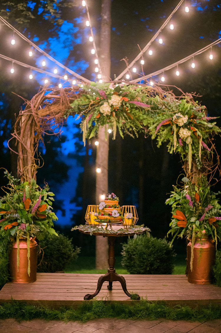 Festoon Lighting Cake Display Outdoors Archway Branches Whimsical Woods Wedding Barn Ohio http://www.connectionphotoblog.com/