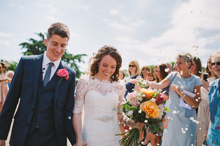 Bride Bridal Dress Gown Sweetheart Neckline Lace Jacket Diamante Belt Moss Bros Groom Navy Suit Three Piece Waistcoat Bouquet Dahlia Rose Berries Greenery Confetti Shot Real Flower Petal Fairy Lights Vibrant Florals Summer Barn Wedding https://www.oliviajudah.co.uk/