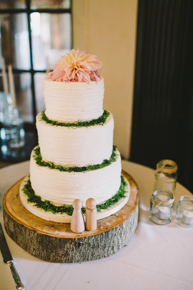 Buttercream Cake Table Greenery Dahlia Wood Slice Stand Tree Fairy Lights Vibrant Florals Summer Barn Wedding https://www.oliviajudah.co.uk/