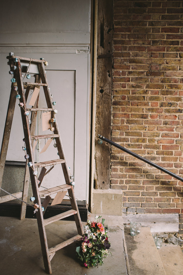 Stepladder Table Plan Seating Chart Rustic Wooden Fairy Lights Vibrant Florals Summer Barn Wedding https://www.oliviajudah.co.uk/