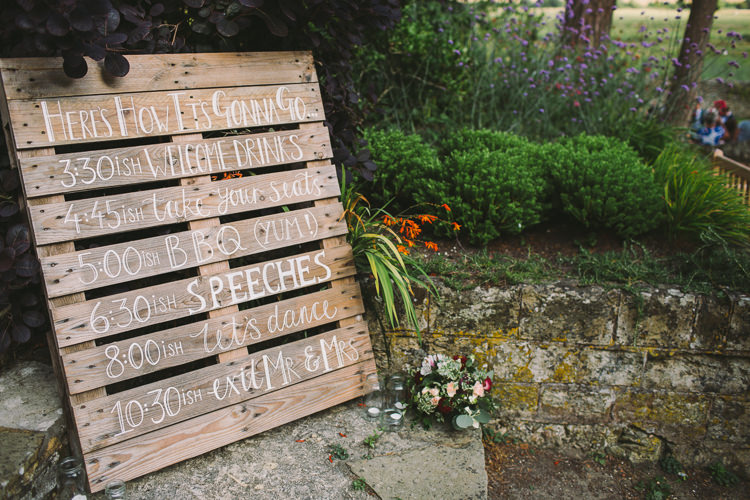 Order of Day Programme Pallet Sign Signage Welcome Fairy Lights Vibrant Florals Summer Barn Wedding https://www.oliviajudah.co.uk/