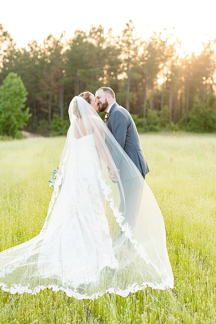 Bride Updo Long Veil Lace Gown Sweetheart Neckline Groom Grey Blue Intimate Farmhouse Wedding South Carolina https://jessicahuntphotography.com/