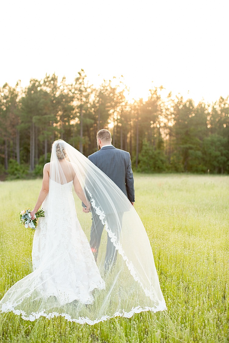Bride Updo Long Veil Lace Gown Sweetheart Neckline Groom Grey Blue Intimate Farmhouse Wedding South Carolina https://jessicahuntphotography.com/
