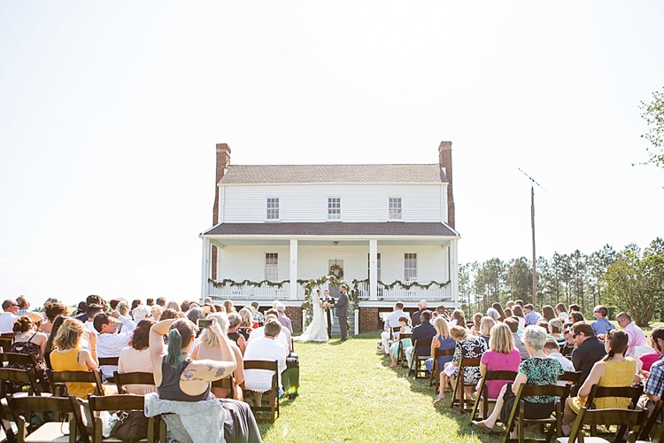 Outdoor Ceremony Guests Greenery Archway Intimate Farmhouse Wedding South Carolina https://jessicahuntphotography.com/