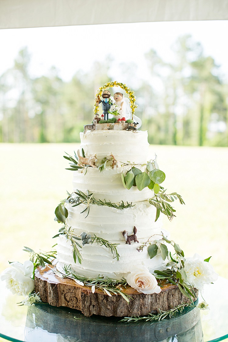 Cake Figurines Topper Pets White Tiers Flowers Greenery Intimate Farmhouse Wedding South Carolina https://jessicahuntphotography.com/
