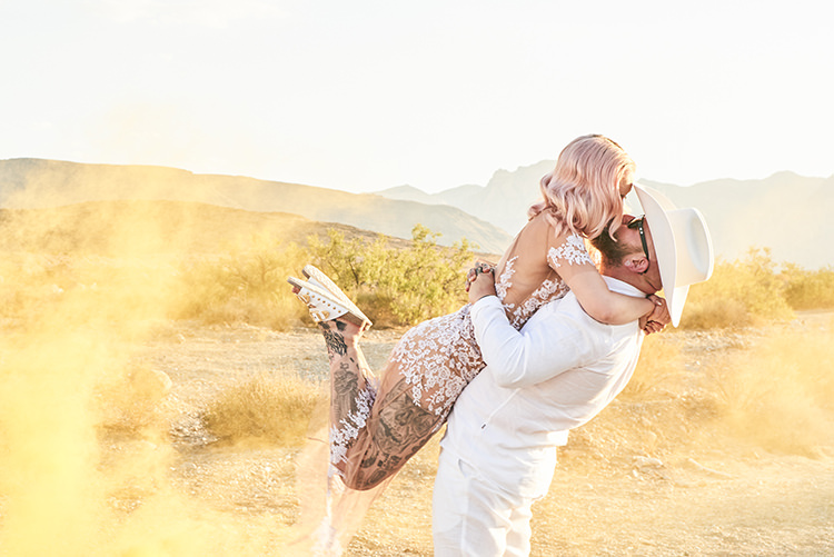 Yellow Smoke Desert Groom Cowboy Hat White Bride Pink Hair Blush Gown Lace Sheer Tattoos Hip Elvis Las Vegas Destination Wedding http://www.roseimages.co.uk/