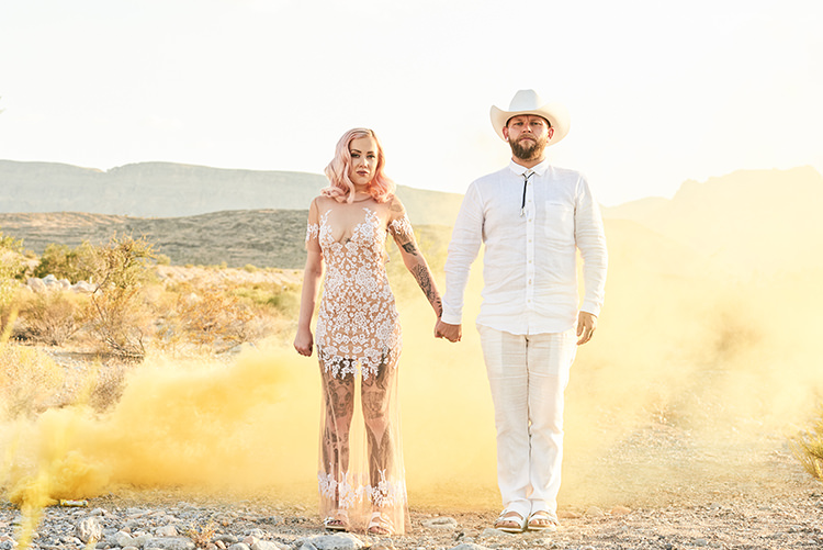 Yellow Smoke Desert Groom Cowboy Hat White Bride Pink Hair Blush Gown Lace Sheer Tattoos Hip Elvis Las Vegas Destination Wedding http://www.roseimages.co.uk/