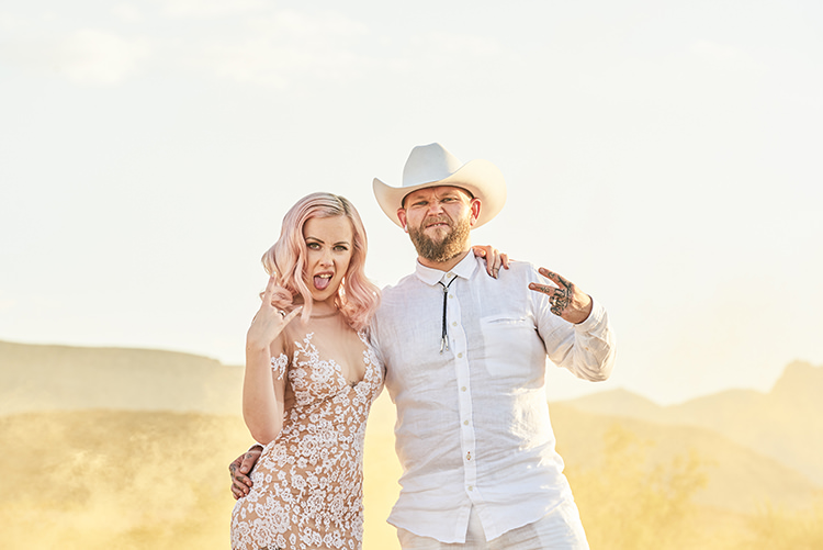 Yellow Smoke Desert Groom Cowboy Hat White Bride Pink Hair Blush Gown Lace Sheer Tattoos Hip Elvis Las Vegas Destination Wedding http://www.roseimages.co.uk/