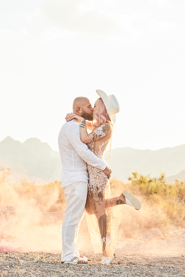 Smoke Desert Groom Cowboy Hat White Bride Pink Hair Blush Gown Lace Sheer Tattoos Hip Elvis Las Vegas Destination Wedding http://www.roseimages.co.uk/