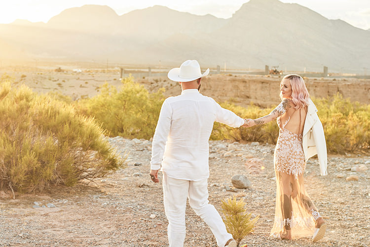 Leather Jacket Sunset Desert Groom Cowboy Hat White Bride Pink Hair Blush Gown Lace Sheer Tattoos Hip Elvis Las Vegas Destination Wedding http://www.roseimages.co.uk/