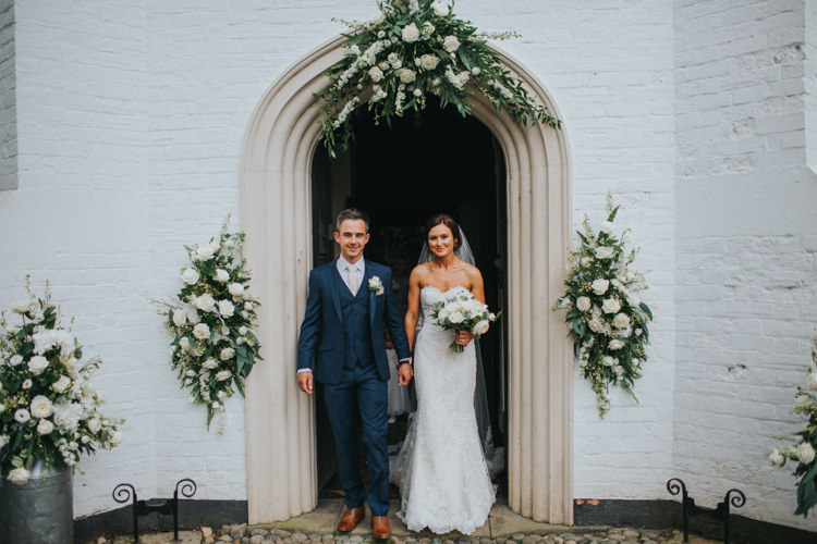 Bride Bridal Pronovias Strapless Sweetheart Fishtail Train Veil White Rose Bouquet Navy Suit Groom Church Display Floral Arrangements Chic Romantic Florals Candlelight Wedding http://lisawebbphotography.co.uk/