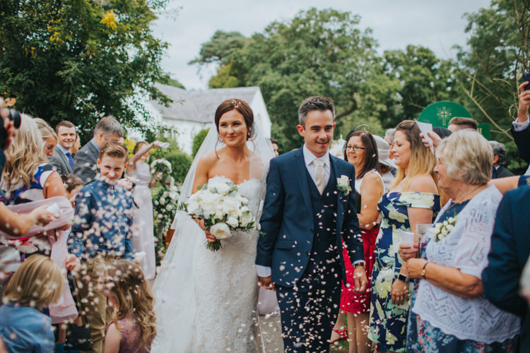Bride Bridal Pronovias Strapless Sweetheart Fishtail Train Veil White Rose Bouquet Navy Suit Groom Confetti Shot Moment Chic Romantic Florals Candlelight Wedding http://lisawebbphotography.co.uk/