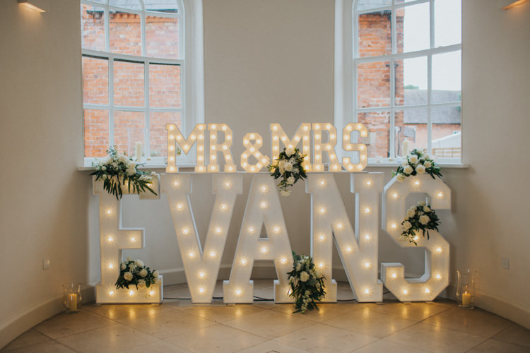Light up Letters Mr & Mrs Circus Bulb White Roses Greenery Chic Romantic Florals Candlelight Wedding http://lisawebbphotography.co.uk/