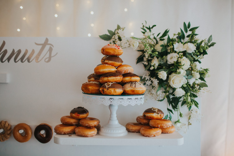 Doughnut Cake Stand Doughnut Wall White Rose Greenery Modern Calligraphy Chic Romantic Florals Candlelight Wedding http://lisawebbphotography.co.uk/