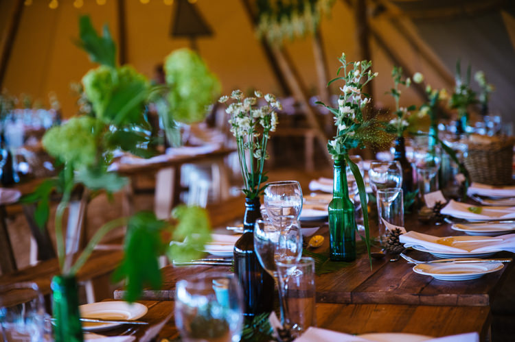 Green Bottle Flowers Foliage Greenery Rustic Tables Magical Woodland Glade Tipi Wedding http://johnnydent.co.uk/