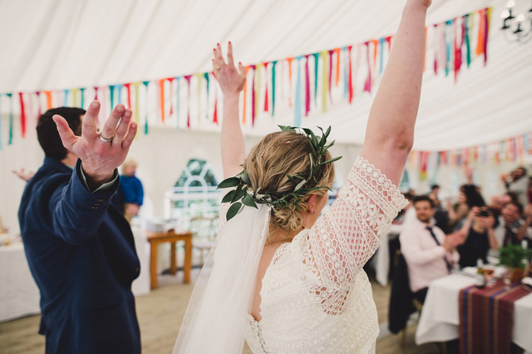 Bride Bridal Lace Guipure Topper Sleeves Dress Gown Veil Greenery Foliage Leaf Crown Entrance Bespoke Navy Groom Multicoloured Streamers Fun Happy Colourful Wedding Vegetable Bouquets https://mylo-photography.co.uk/