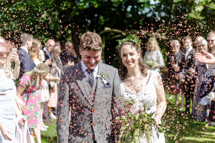 Bespoke Bride This Modern Love Bridal Greenery Foliage Hair Vintage Suit Groom Waistcoat Tweed Pocket Watch Chain Confetti Shot Moment Natural Outdoor Tipi Wedding https://www.ad-photography.co.uk/