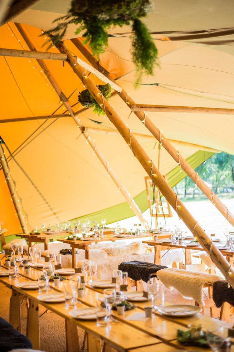 Fairy Lights Greenery Sheepskin Benches Natural Outdoor Tipi Wedding https://www.ad-photography.co.uk/