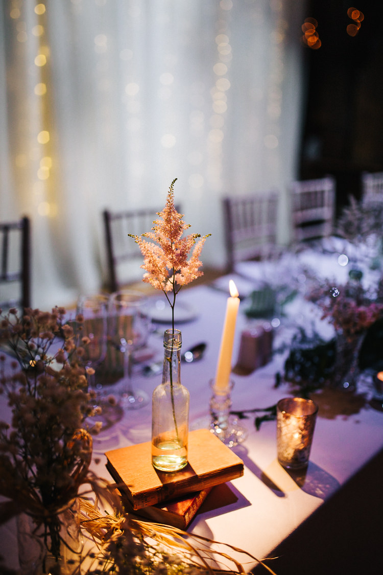 Bottle Flowers Books Candles Astilbe Exquisite Relaxed Rustic Barn Wedding http://www.emiliemay.com/