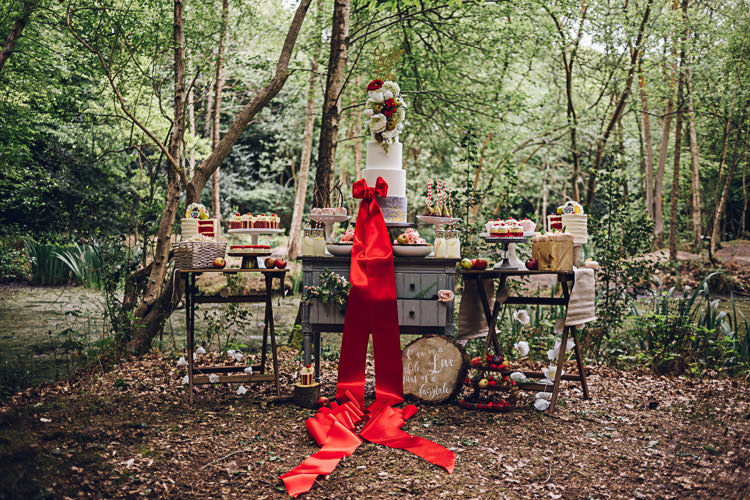 Dessert Table Tall Five Tier Cake Ribbon Red Magical Snow White Woodland Wedding Ideas https://www.chloeleephoto.co.uk/