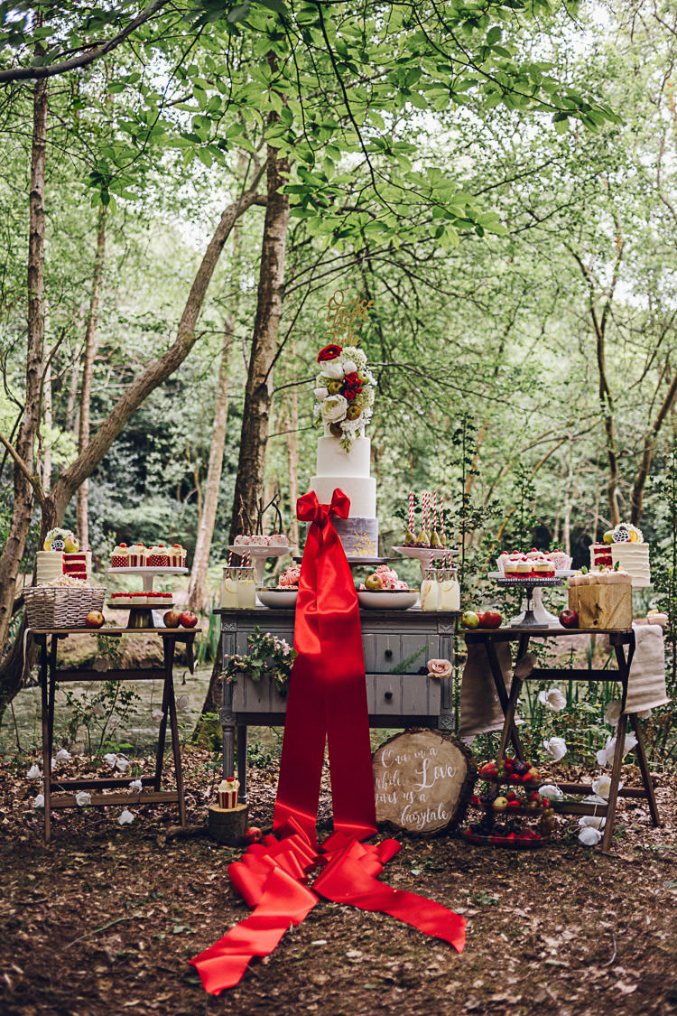 Dessert Table Tall Five Tier Cake Ribbon Red Magical Snow White Woodland Wedding Ideas https://www.chloeleephoto.co.uk/