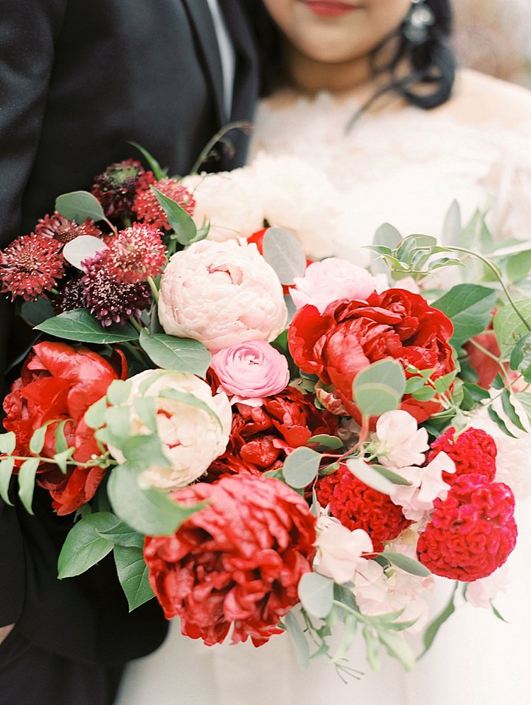 Bride Groom Lace Dress Off Shoulder Sleeves Bouquet Red Pink Peonies Roses Greenery Modern Romantic Winter Wedding Texas http://www.albarosephotography.com/