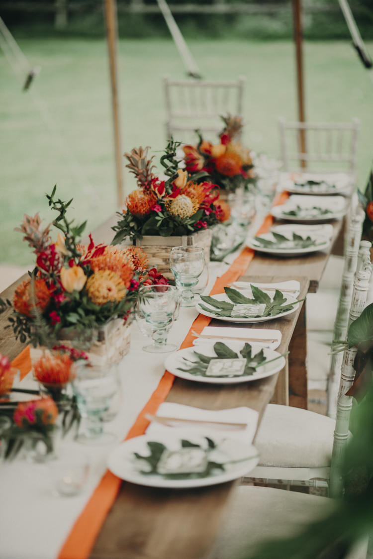 Long Tables Flowers Decor Palm Leaves Tablescape Vibrant Tropical Wedding Ideas http://foto-memories.co.uk/