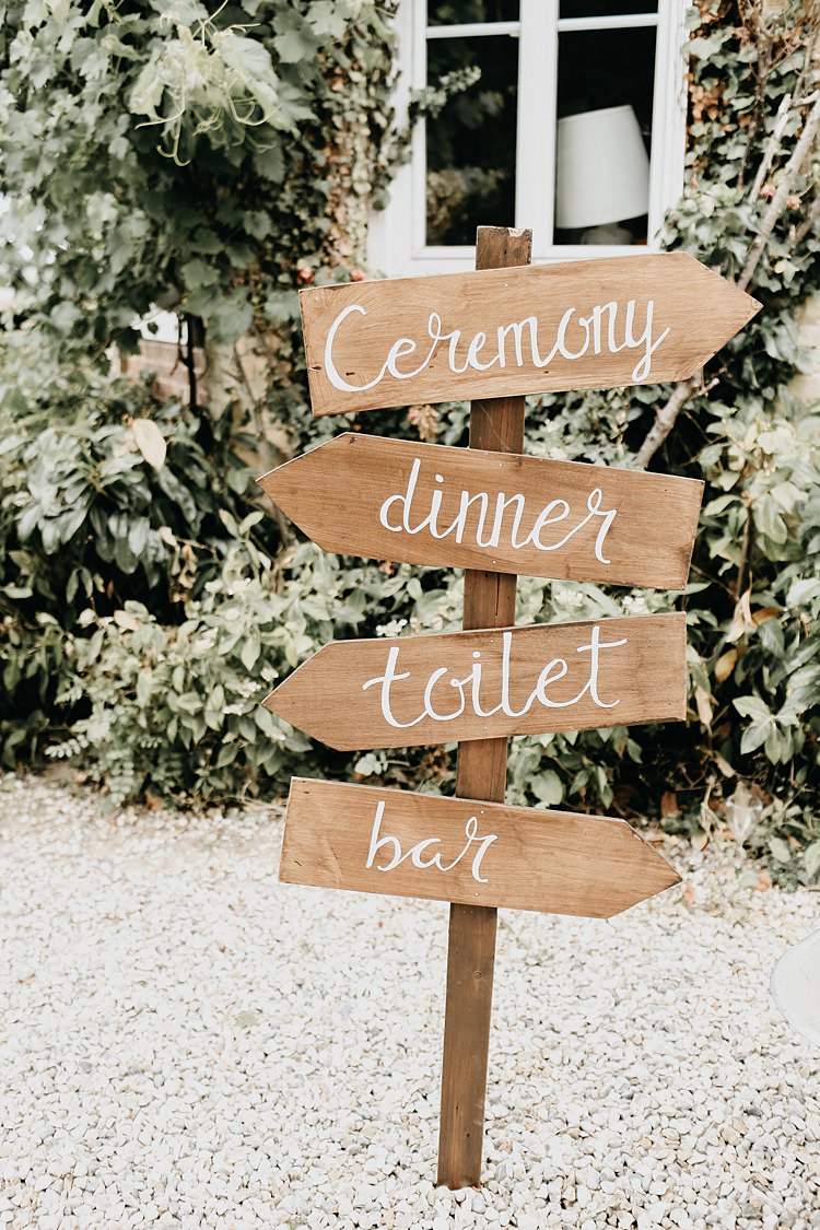 Wooden Painted Calligraphy Sign Post Rustic Greenery Copper Chateau Wedding in France http://hindmari.com/