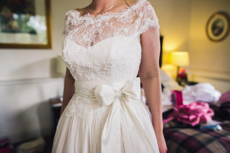 Lace Dress Gown Bride Bridal Bow Sash Outdoorsy Welcoming Colourful Tipi Wedding http://www.sallytphoto.com/
