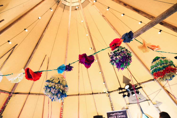 Pom Pom Festoon Lights Outdoorsy Welcoming Colourful Tipi Wedding http://www.sallytphoto.com/