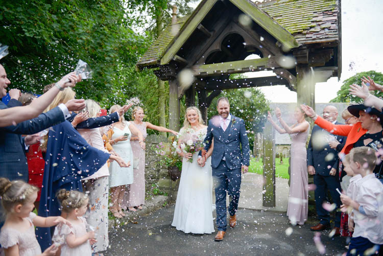 Bride Bridal Justin Alexander Dress Gown A Line Slaters Menswear Groom Grey Checked Three Piece Waistcoat Suit Pocket Square Watch Pink Tie Confetti Shot Moment Church Lychgate Fun Pastel Country Marquee Wedding http://kimberleywaterson.com/