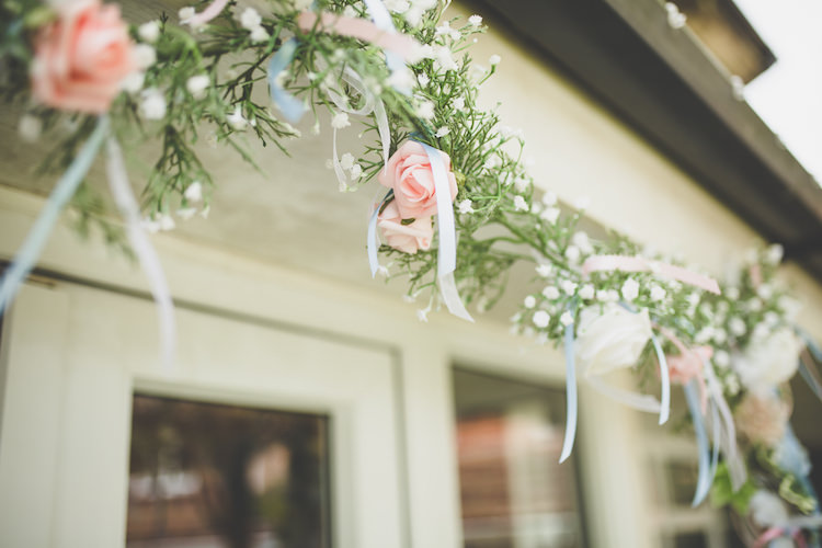 Door Garland Rose Gypsophila Ribbon Greenery Black Tie Glamour Country Estate Wedding https://www.chrisblackledgephotography.co.uk/