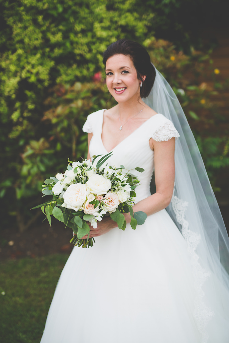 Bride Bridal Ronald Joyce A Line Dress V Neck Cap Sleeve Long Lace Edged Veil Loose Bouquet Foliage Greenery Black Tie Glamour Country Estate Wedding https://www.chrisblackledgephotography.co.uk/