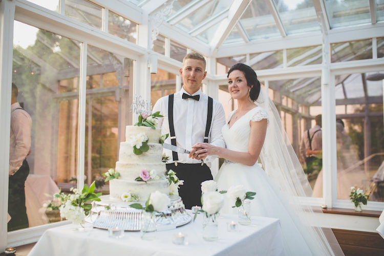 Semi-Naked Cake Buttercream Mr & Mrs Cut Out Topper Glitter Cutting Bride Bridal Ronald Joyce A Line Dress Long Veil Cap Sleeve Groom Braces Bow Tie Black Tie Glamour Country Estate Wedding https://www.chrisblackledgephotography.co.uk/