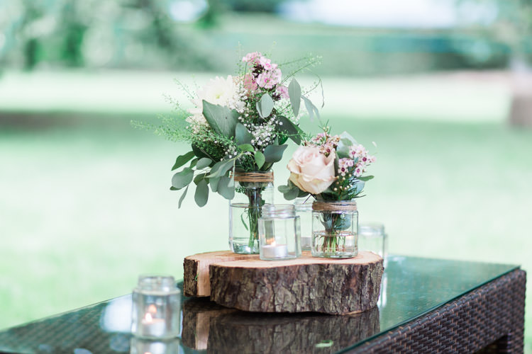 Jars Flowers Log Slice Simple Natural Honest Marquee Wedding https://www.gemmagiorgio.com/