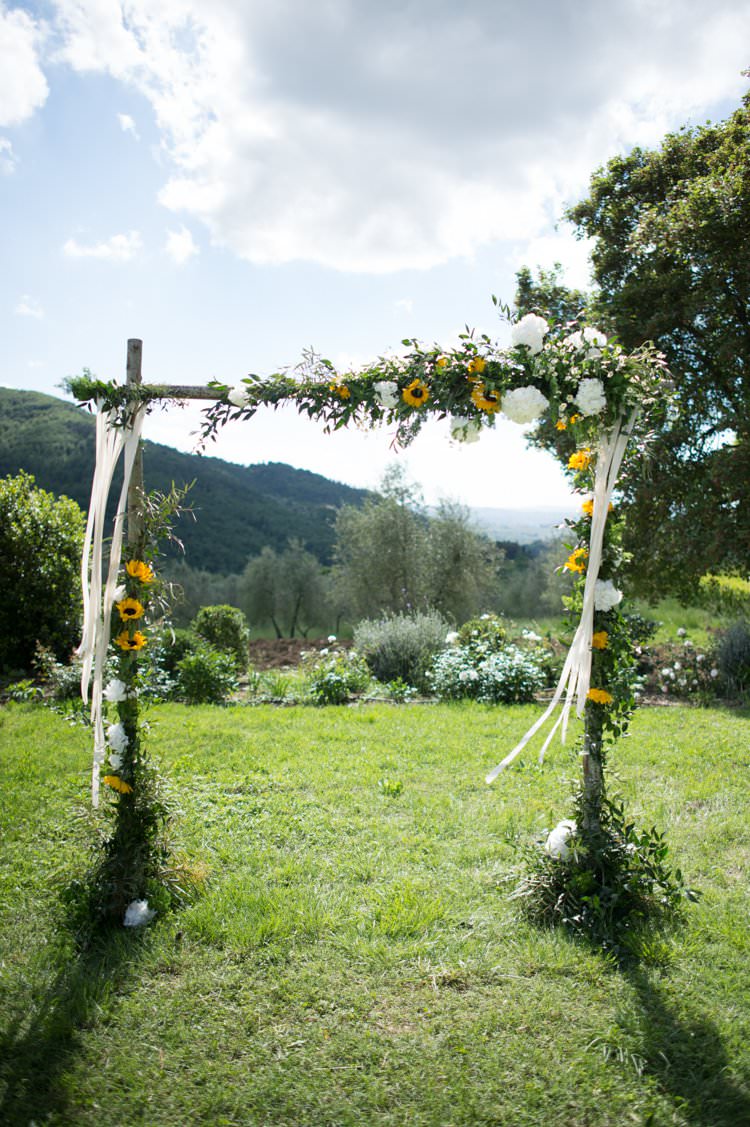 Ceremony Archway Ribbons Sunflowers Yellow Navy Outdoor Tuscany Wedding http://www.natalymontanari.com/