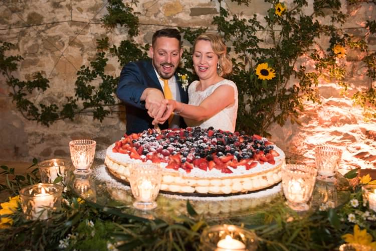 Italian Cake Cutting Cream Berries Sunflowers Candles Yellow Navy Outdoor Tuscany Wedding http://www.natalymontanari.com/