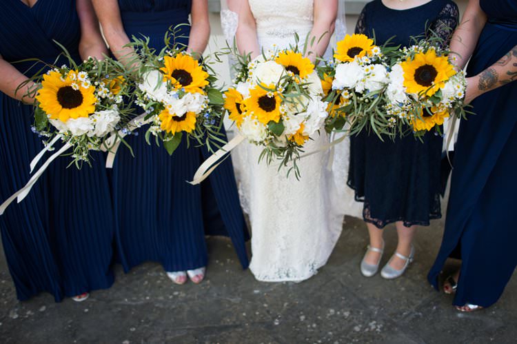 Bouquets Sunflowers Roses Daisies Bridesmaids Yellow Navy Outdoor Tuscany Wedding http://www.natalymontanari.com/