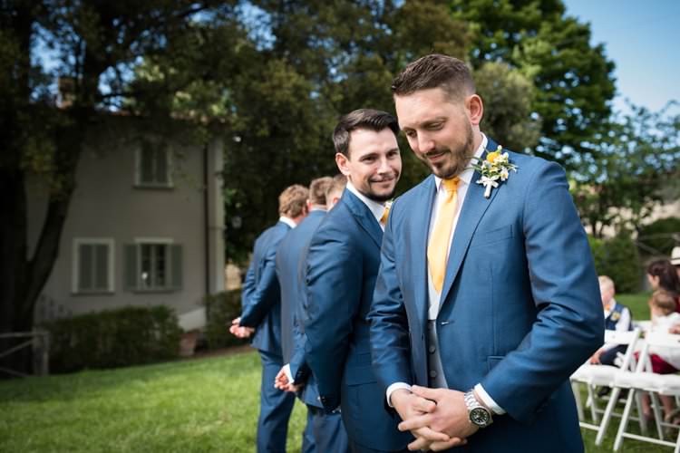 Groom Groomsmen Waiting Aisle Ceremony Yellow Navy Outdoor Tuscany Wedding http://www.natalymontanari.com/