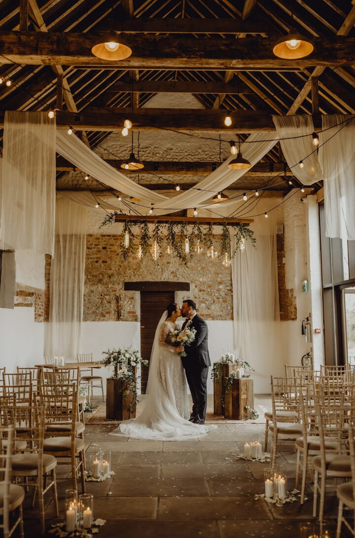 Barn Ceremony Wedding Drapes Flowers Lighting Aurora Grey Photography