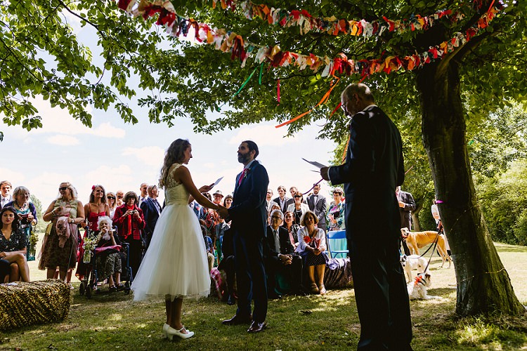 Outdoor Ceremony Bride Bridal Lace Embellished Mesh ASOS Sleeveless Tea Length Dress Gown Next Groom Hay Bale Seating Multicoloured Hand Made Fun Outdoor Wedding https://www.sharrongibson.co.uk/
