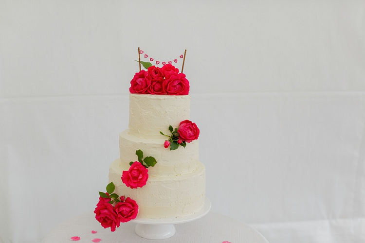 Cake Tiered Buttercream Flowers Floral Rose Bunting Topper Stand Multicoloured Hand Made Fun Outdoor Wedding https://www.sharrongibson.co.uk/