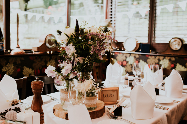 Jar Flowers Log Slice Table Decor Unique Personal Natural Wedding Style https://photo.shuttergoclick.com/