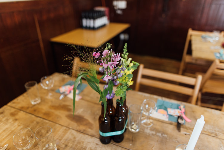 Brown Beer Bottle Flowers Centrpeice Alternative Colourful Outdoor Humanist Village Hall Wedding http://www.chebirchhayesphotography.com/