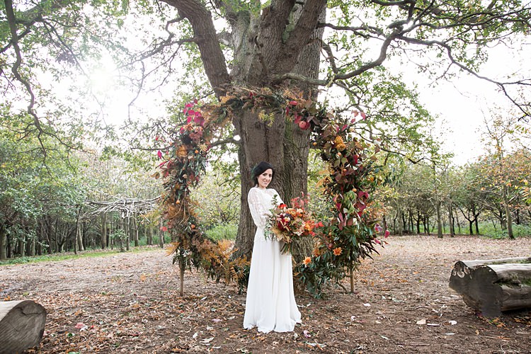 Wreath Hoop Large Backdrop Flowers Floral Orange Red 1970s Gypsy Bohemian Autumn Woodland Wedding Ideas http://carolineopacicphotography.com/